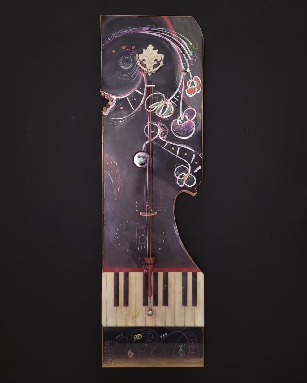 Tall mixed-media assemblage with piano keys, strings, and sweeping chalk drawing on a dark panel