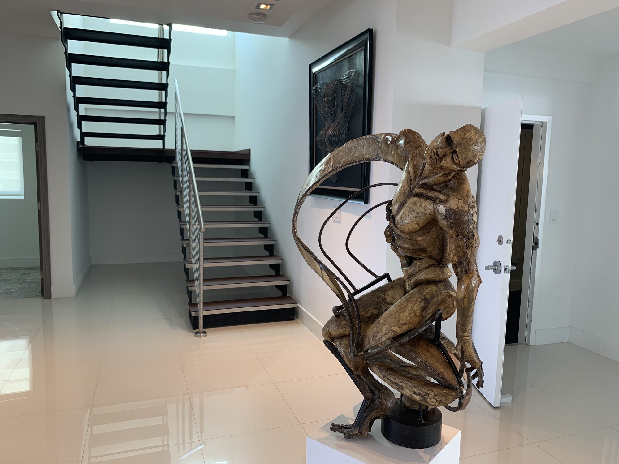 Bronze sculpture staged in a luxury penthouse entry